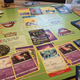 A Pokemon TCG game in full flow, cards all over a green board.